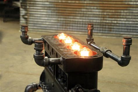 Steampunk industrial / carroll shelby / 427 engine block / automotive / barnwood / coffee table #3330 $9,299.99 steampunk industrial table / pub, sofa console / 55 / antique furnace door / steam gauge / barnwood / table #3323 Steampunk Industrial / Antique Model "T" Engine Block ...