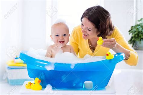 Happy Baby Taking A Bath Playing With Foam Bubbles Mother Washing