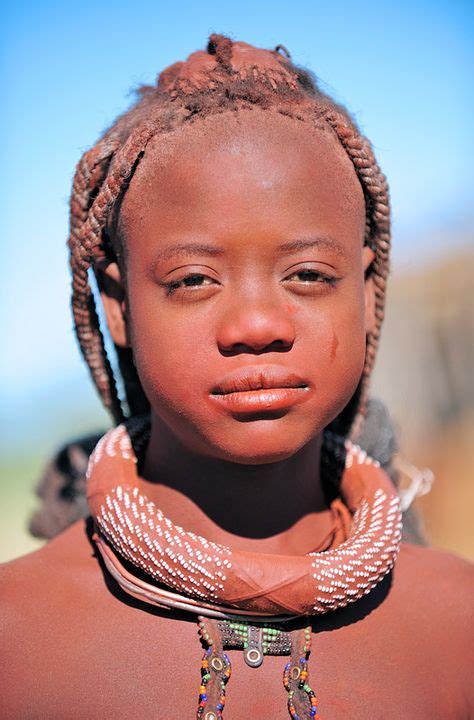 A Young Himba Girl Smiles For A Photo In Northern Namibia Faces