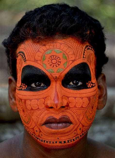 The performance has intricate rituals. Make up of Vishnumoorthi Theyyam | Tribal face, Face, Face art