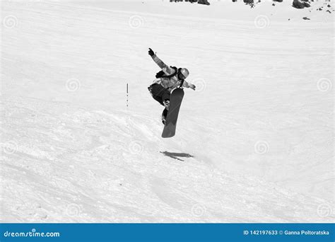 Snowboarder Jumping On Snowy Ski Slope Editorial Stock Photo Image Of