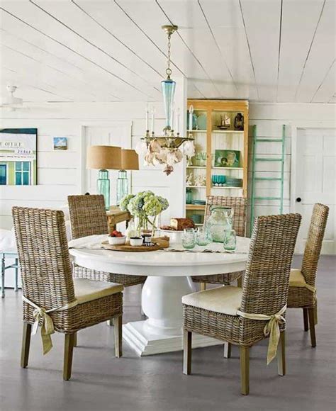Beach Style Dining Room With Round White Table And Wicker Parsons
