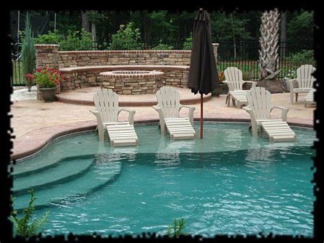 Many people choose to enlist the. In pool Adirondack chairs with an in-pool sun umbrella ...