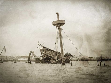 An Old Photo Of A Boat In The Water With Its Mast Sticking Out