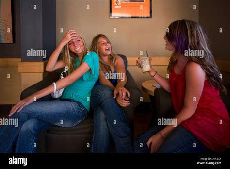 Three Teen Girls Have A Laughing Conversation In A Southern California Coffee Shop Not Released
