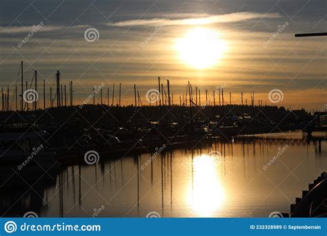 Late Afternoon Sun Reflects On Water In A Marina Stock Image Image Of