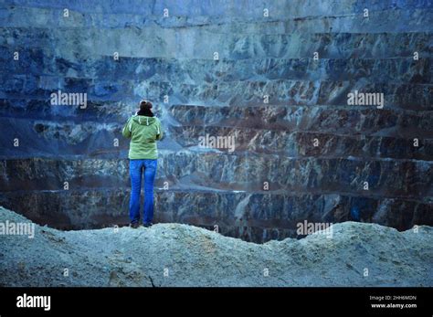 Geologist Studying Gigantic Open Cast Gold And Copper Mine Terraces