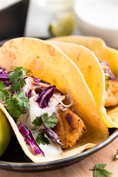 Easy Baja Fish Tacos Topped With Creamy Cilantro Lime Slaw