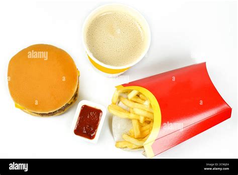 Fast Food Burger And Fries With Ketchup And Cofee On White Background