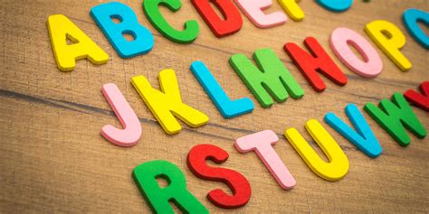 Download Abc Letters On Wooden Table Wallpaper