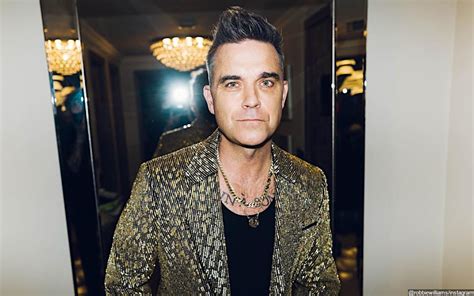 robbie williams says he doesn t condone some sex scenes in his biopic better man