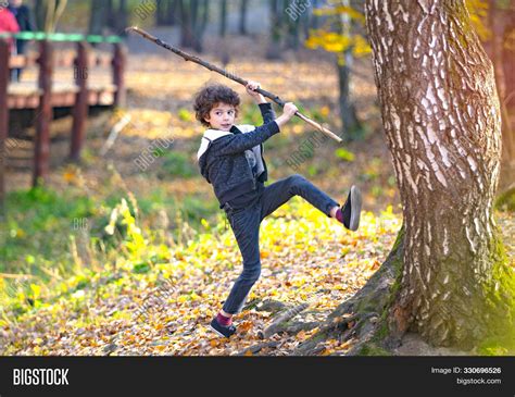 Little Boy Play Stick Image And Photo Free Trial Bigstock