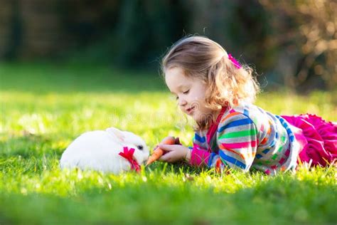 Child With Rabbit Easter Bunny Kids And Pets Stock Photo Image Of