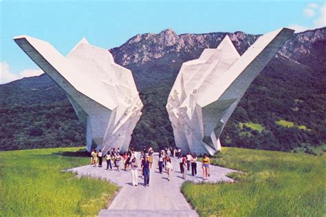 Visitors At The Massive And Futuristically Abstract War Memorial At