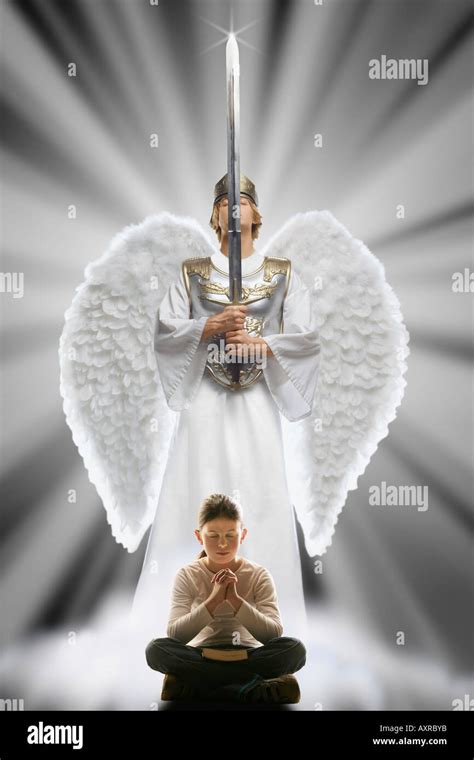 Girl Praying With Angel Protecting Her Stock Photo Alamy