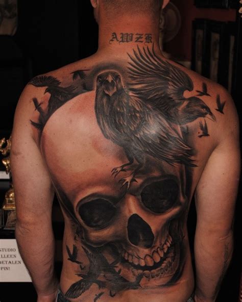Great Realistic Skull And Black Ravens Tattoo By Guillermo Pokaluk