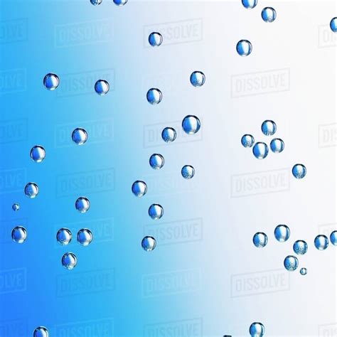 Water Droplets On A Blue Surface Close Up Stock Photo Dissolve
