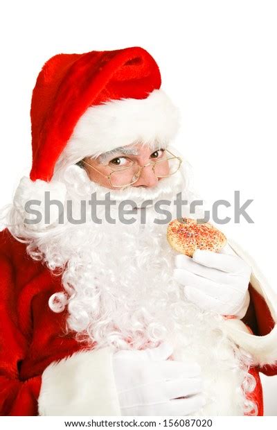 Cheerful Santa Claus Eating Christmas Cookie Stock Photo Edit Now