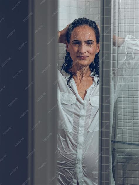 Premium Photo Sensual Hispanic Woman In Wet White Shirt In Shower Cabin
