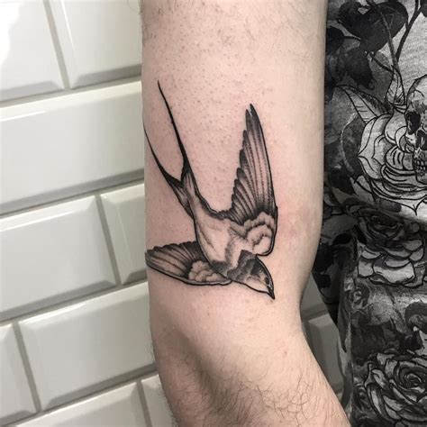 Black And Grey Swallow Tattoo On The Right Arm Black Bird Tattoo Bird Tattoos Arm Swallow