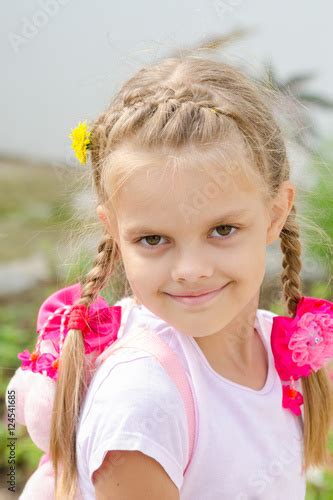 Portrait Of A Beautiful Six Year Old Girl With Blond Hair Stock Photo