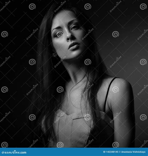 Beautiful Makeup Seriois Woman With Long Hair Looking With Half Shadow On The Face Closeup