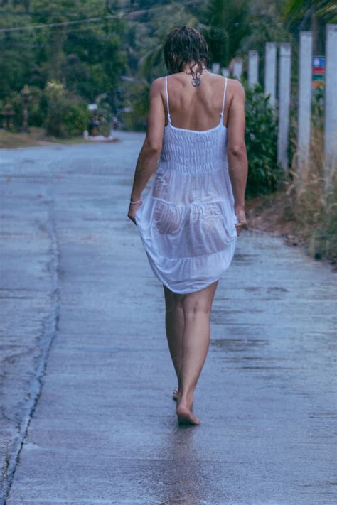 Woman Walking In A Wet Dress After The Rain By Mosuno Rain Sexy Stocksy United