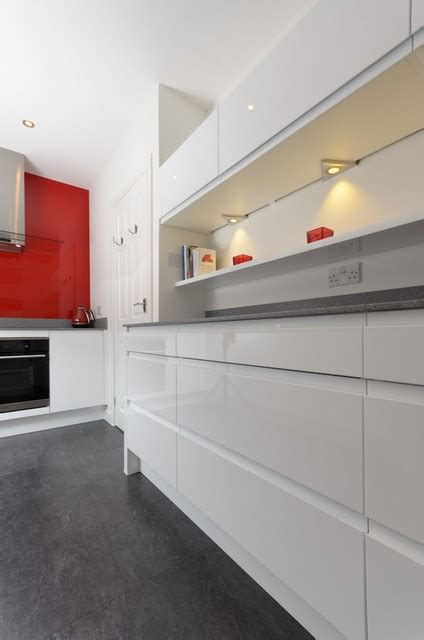 Modern White Kitchen With Accent Red Splashback Contemporary