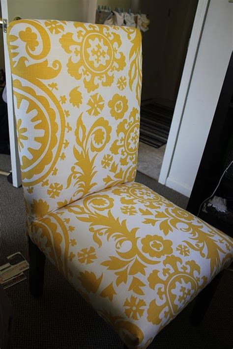 Many dining chairs have a cushion that can be easily detached, which makes reupholstering a simple project. Reupholstering our parsons chairs: