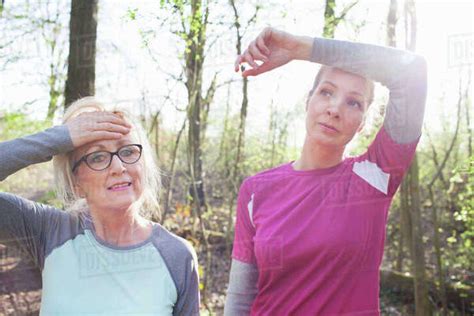 Women In Forest Hand On Forehead Looking Exhausted Stock Photo Dissolve