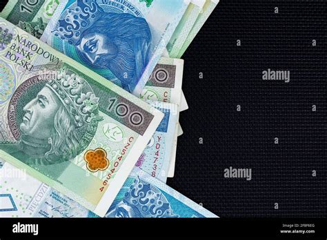 Polish Banknotes Of Pln 100 And Pln 50 On A Black Background Photo