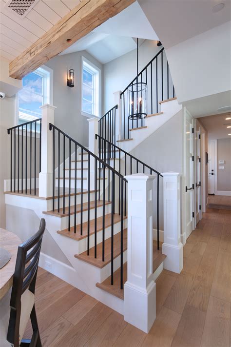 Iron Stair Rails With White Oak Wood Floors And Overhead Beams Create A