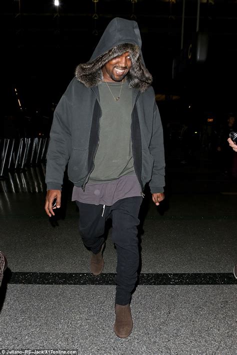 Kanye West Cracks A Rare Smile As He Flies Out Of Los Angeles Daily