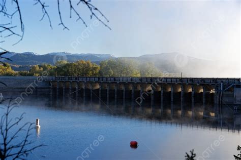 Jackson Lake Dam In Grand Teton National Park Photo Background And