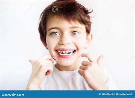 Horizontal Portrait Of 7 Years Old Smiling Child In White T Shirt
