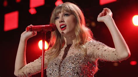 Taylor Swift In Red Lightning Background Wearing Glittering Dress