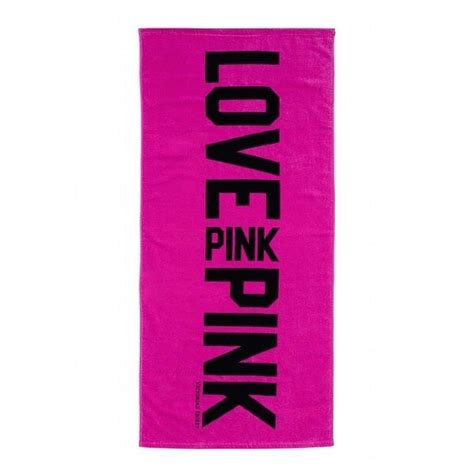 A Pink Towel With The Words Love Pink Printed In Black On It Against A
