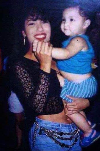 Selena Quintanilla Taking A Picture With A Baby Selena Quintanilla