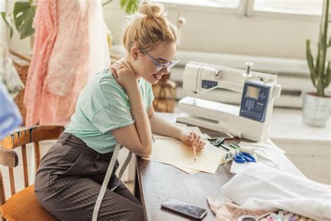 Fashion Designer At Work Talanted Dressmaker Drawing Sketch At Her