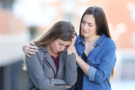 Worried Woman Comforting Her Sad Friend In The Street Christian Leader