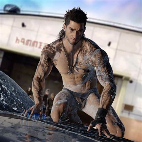 A Man With Tattoos And No Shirt On Standing Next To A Car