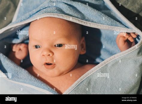 Little Baby In Towel After Bath Stock Photo Alamy