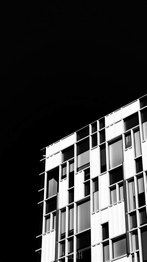 288739 A Black And White Shot Of A Facade With Rectangular Windows In