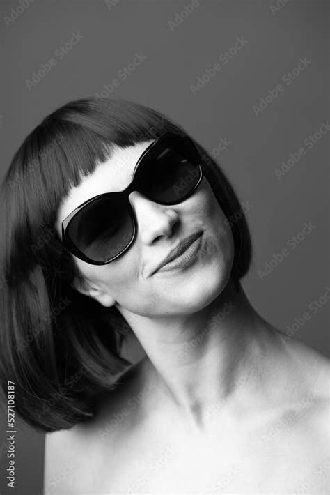 Beauty Fashion Concept Portrait Of Beautiful And Sexy Woman With Wig And Sunglasses Looking To