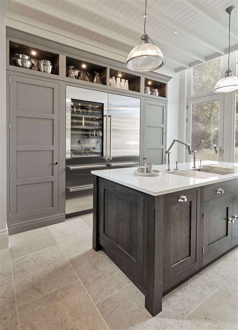 Discover inspiration for your kitchen remodel and discover ways to a combination of white painted cabinetry and rustic hickory cabinets create an earthy and bright kitchen. Modern Grey Kitchen | Tom Howley