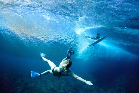 Female Surfers Beneath The Waves Oddetorium