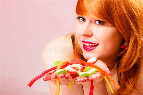 Red Haired Woman Holding Candies In Hands Stock Photo Image Of