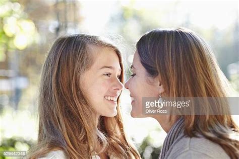 two girls rubbing each other photos and premium high res pictures getty images