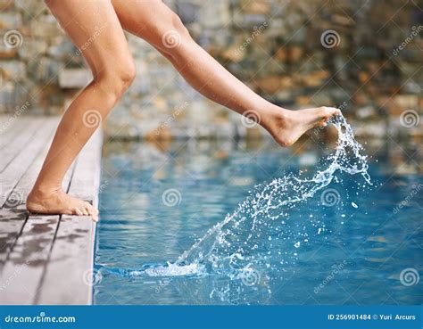 Getting A Feel For The Water A Womans Foot In The Swimming Pool Stock Photo Image Of Classic