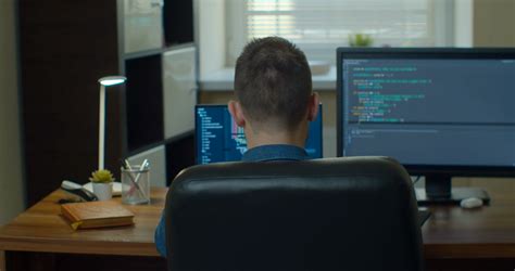 Man Coding Html Programming On Two Screen Stock Footage Sbv 338374765